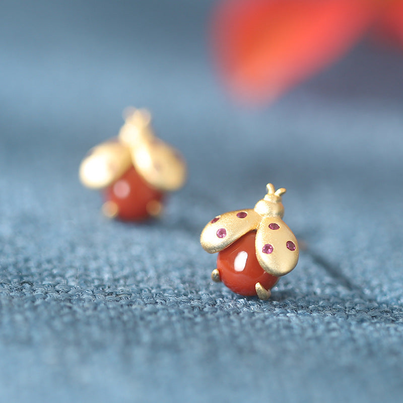 S925 sterling silver gold-plated inlaid red agate worm earrings