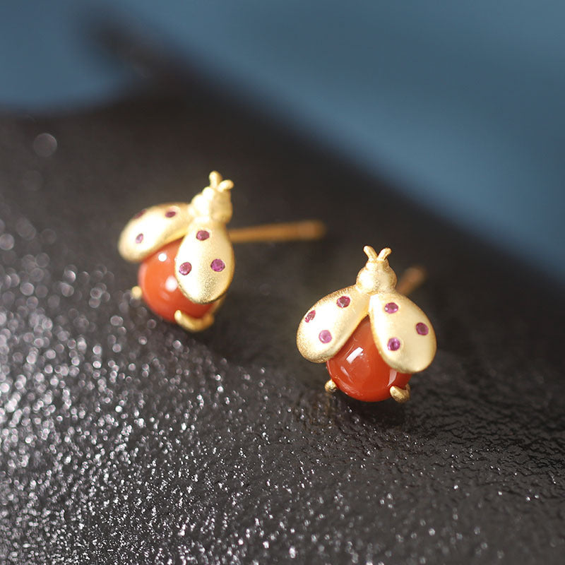 S925 sterling silver gold-plated inlaid red agate worm earrings